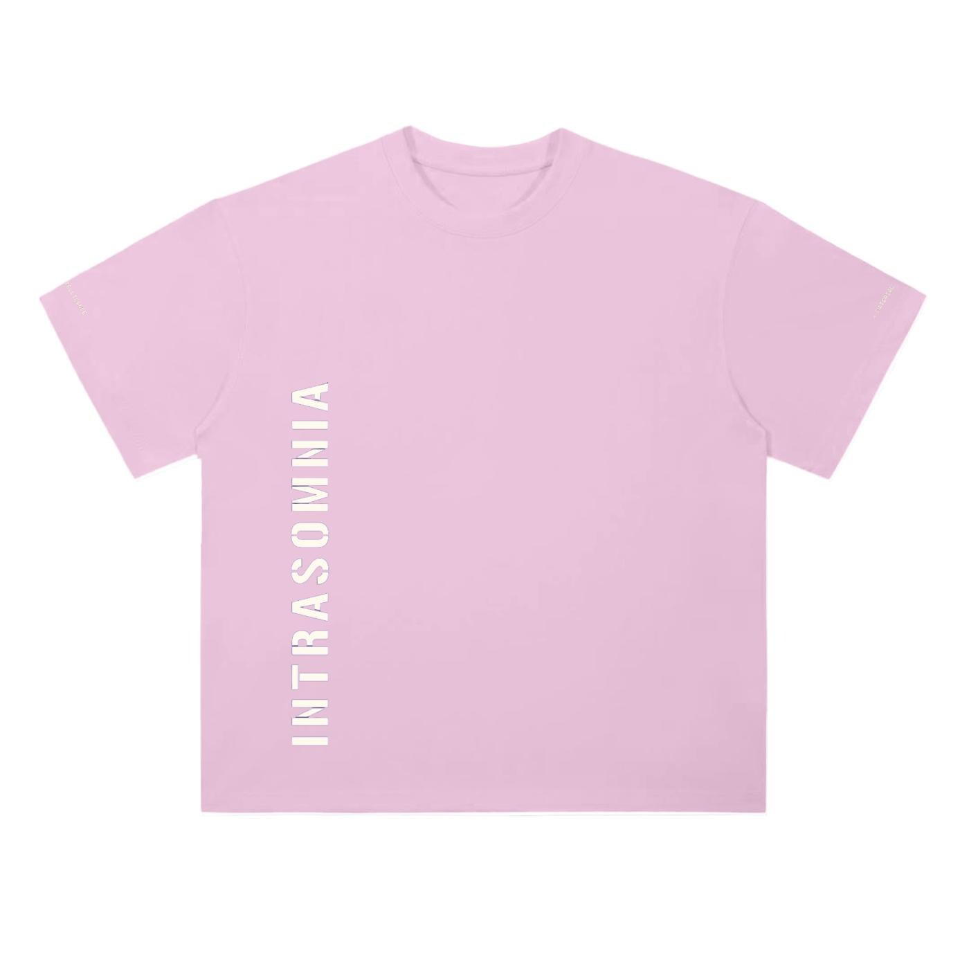 Heavyweight T-Shirt - Intrasomnia Original Logo — pink front view, boxy crewneck t-shirt with vertical INTRASOMNIA text at the lower torso and sleeve text reading MATERIAL and INTELLIGENCE